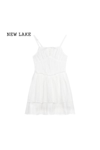 NEW LAKE白色芭蕾风吊带连衣裙女夏季系带鱼骨短裙海边度假风a字蛋糕裙子