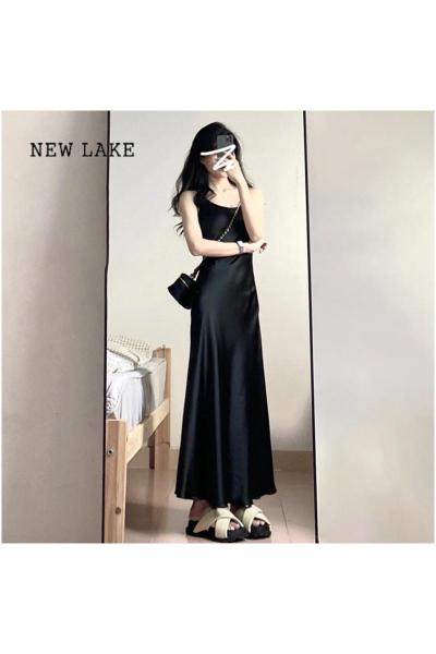 NEW LAKE黑色吊带连衣裙子女夏季2024新款修身小黑裙法式打底显瘦气质长裙