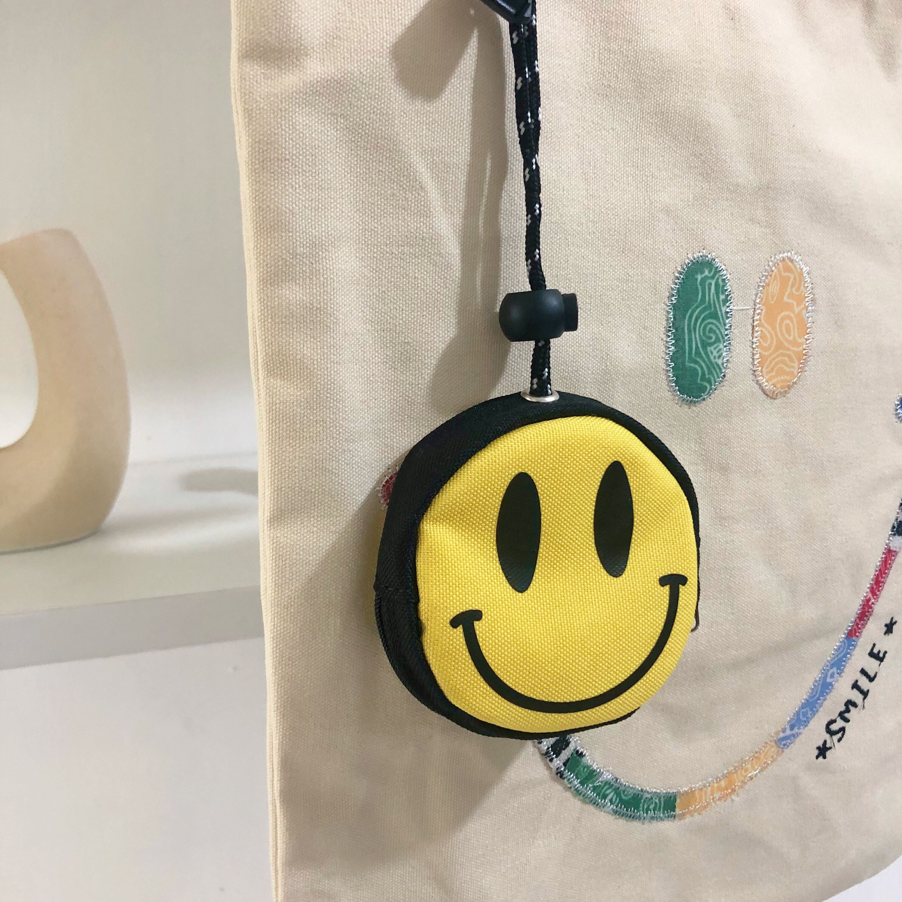 newlakeins潮牌微笑笑脸钥匙包零钱收纳包包挂件便携抽绳设计小包钥匙