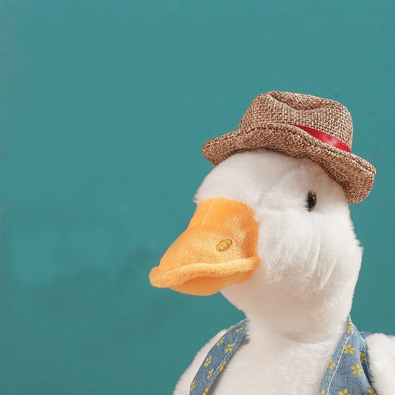 网红电动绅士草帽沙雕复读鸭唱歌复读电动公仔学说话摇头毛绒玩具沙雕